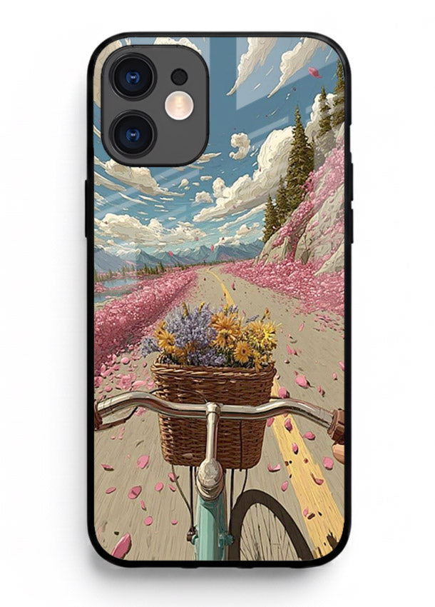 Bicycle with blossom-filled basket artwork on iphone 12 glass back cover with soft scenic floral detailing.