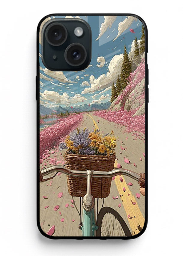 Bicycle with blossom-filled basket artwork on iphone 15 plus glass back cover with soft scenic floral detailing.