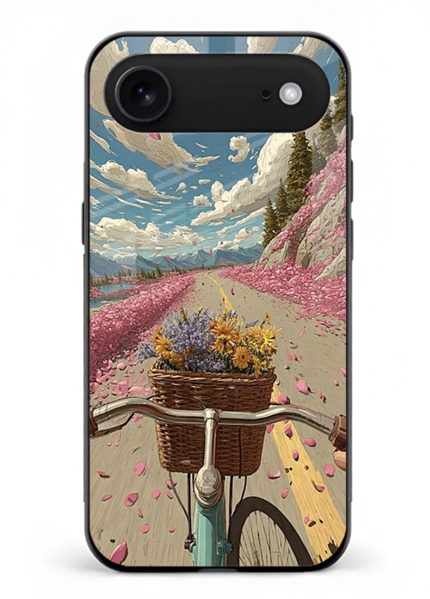 Bicycle with blossom-filled basket artwork on iphone 17 air glass back cover with soft scenic floral detailing.
