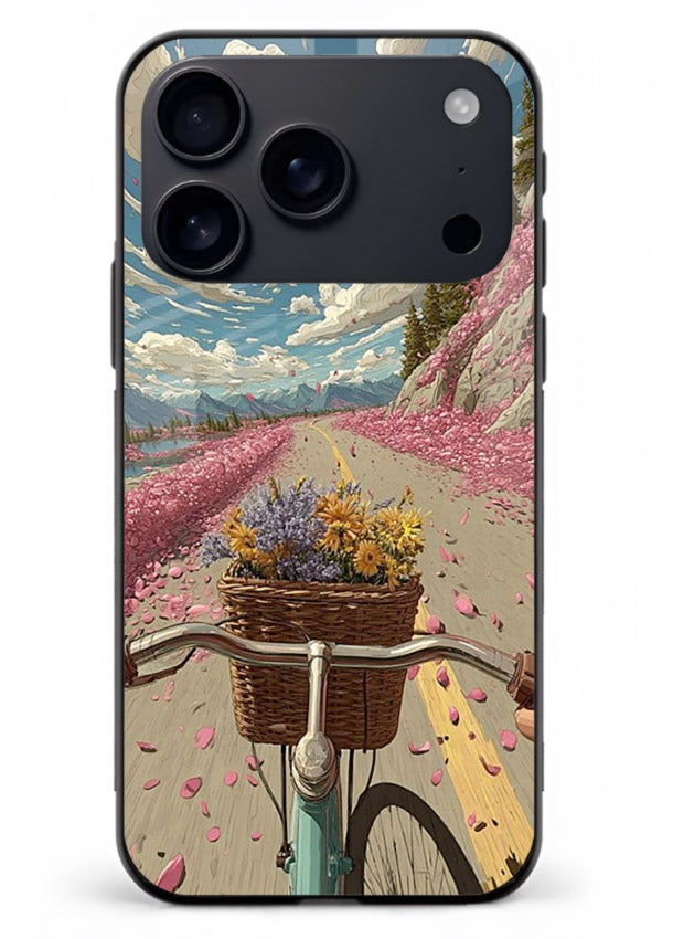 Bicycle with blossom-filled basket artwork on iphone 18 pro max glass back cover with soft scenic floral detailing.