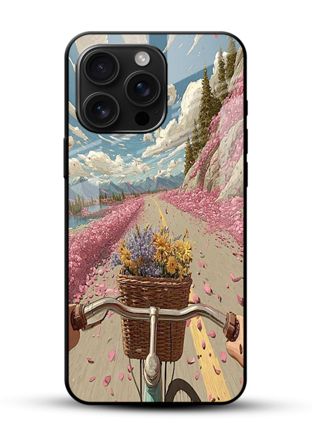 Bicycle with blossom-filled basket artwork on glossy vibrant premium glass back cover with soft scenic floral detailing. - Angle Front