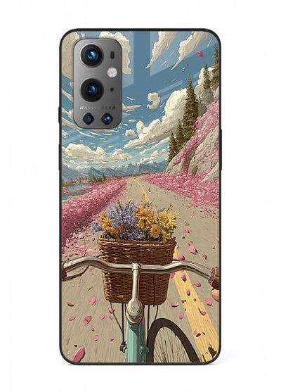 Bicycle with blossom-filled basket artwork on OnePlus 9 glass back cover with soft scenic floral detailing.