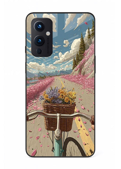 Bicycle with blossom-filled basket artwork on OnePlus 9 Pro glass back cover with soft scenic floral detailing.