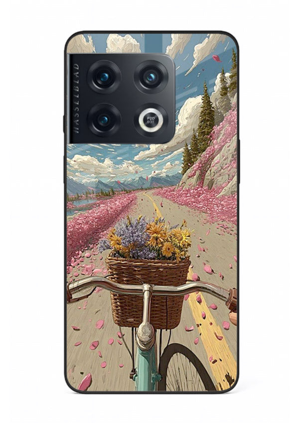 Bicycle with blossom-filled basket artwork on OnePlus 10 Pro glass back cover with soft scenic floral detailing.