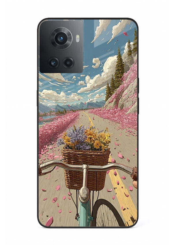 Bicycle with blossom-filled basket artwork on OnePlus 10R glass back cover with soft scenic floral detailing.