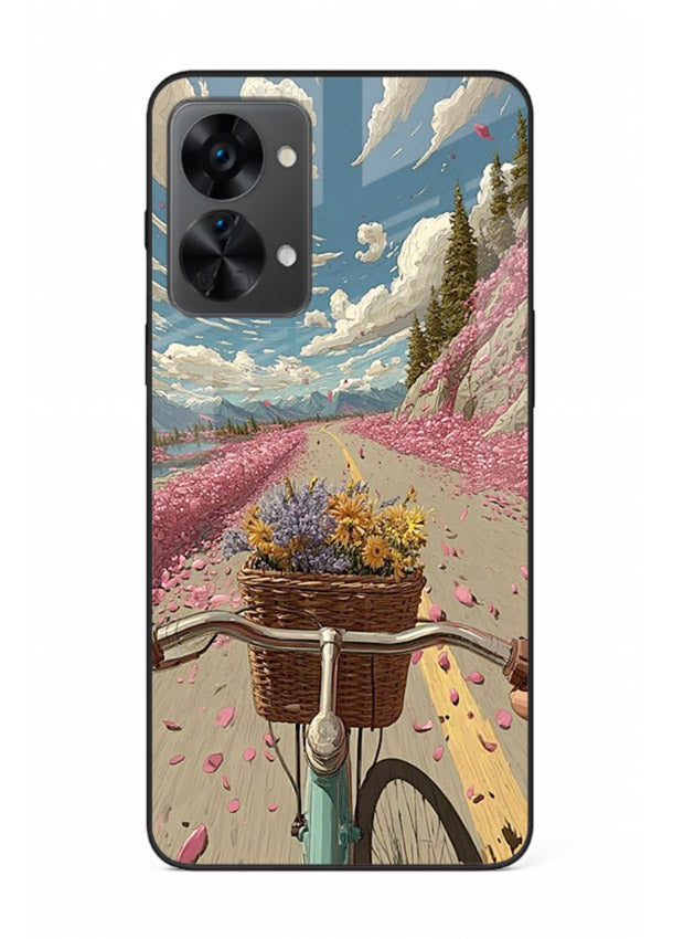 Bicycle with blossom-filled basket artwork on OnePlus Nord 2T glass back cover with soft scenic floral detailing.