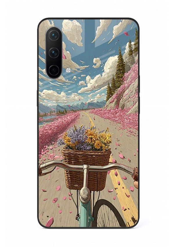Bicycle with blossom-filled basket artwork on OnePlus Nord CE 5G glass back cover with soft scenic floral detailing.