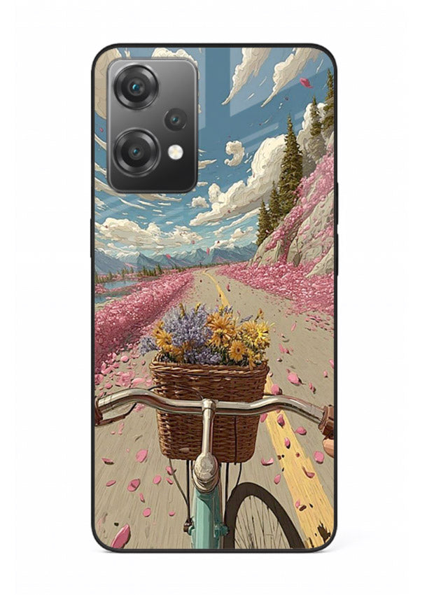 Bicycle with blossom-filled basket artwork on OnePlus Nord CE2 Lite 5G glass back cover with soft scenic floral detailing.