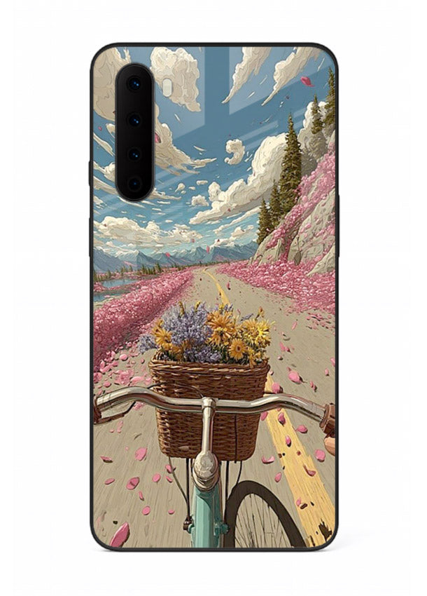 Bicycle with blossom-filled basket artwork on OnePlus Nord glass back cover with soft scenic floral detailing.