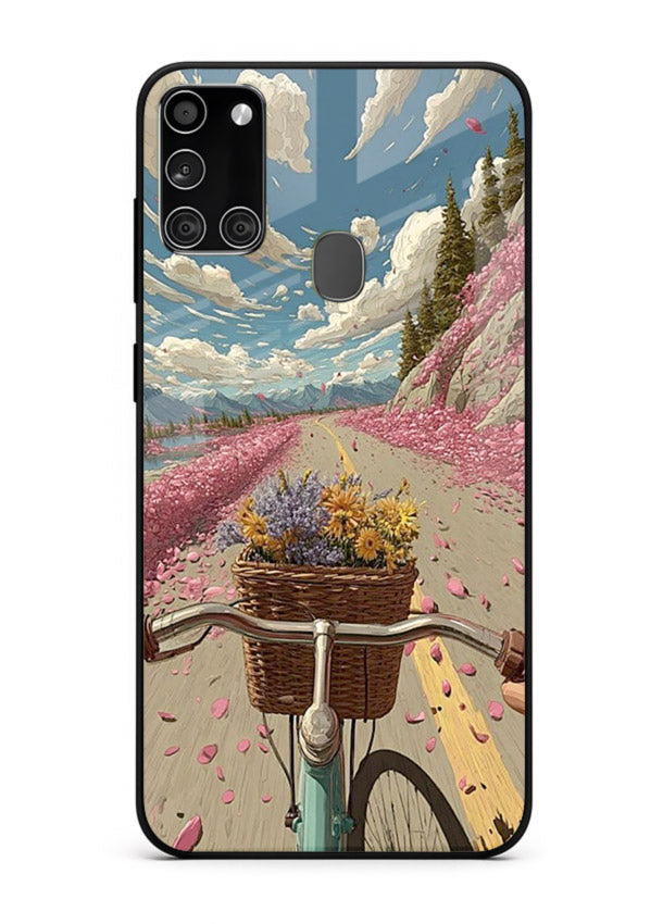 Bicycle with blossom-filled basket artwork on Samsung A21s glass back cover with soft scenic floral detailing.