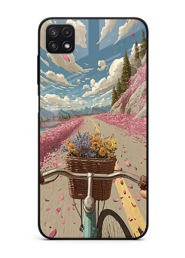 Bicycle with blossom-filled basket artwork on Samsung F42 5G glass back cover with soft scenic floral detailing.