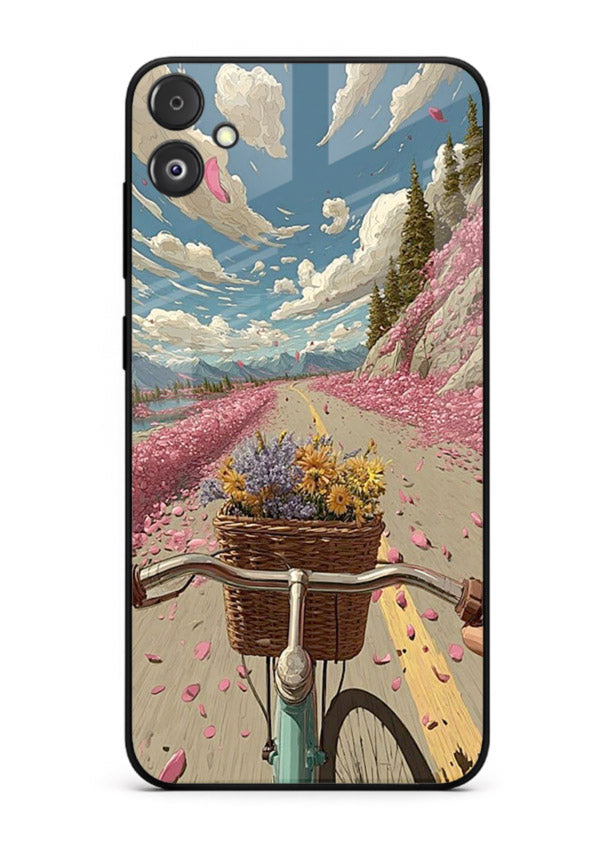 Bicycle with blossom-filled basket artwork on Samsung F05 5G glass back cover with soft scenic floral detailing.