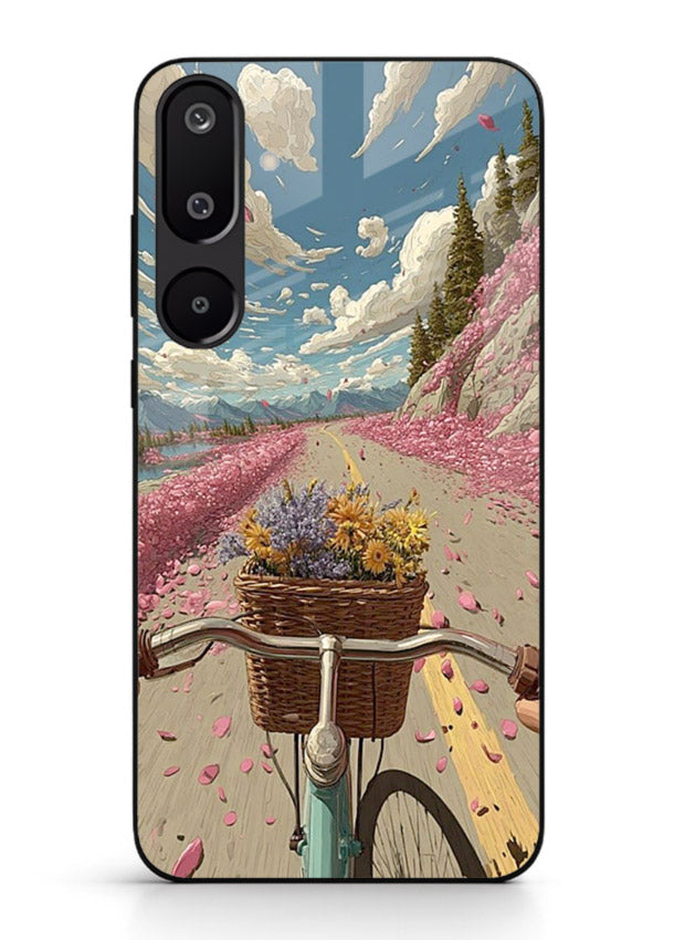 Bicycle with blossom-filled basket artwork on Samsung M16 5G glass back cover with soft scenic floral detailing.