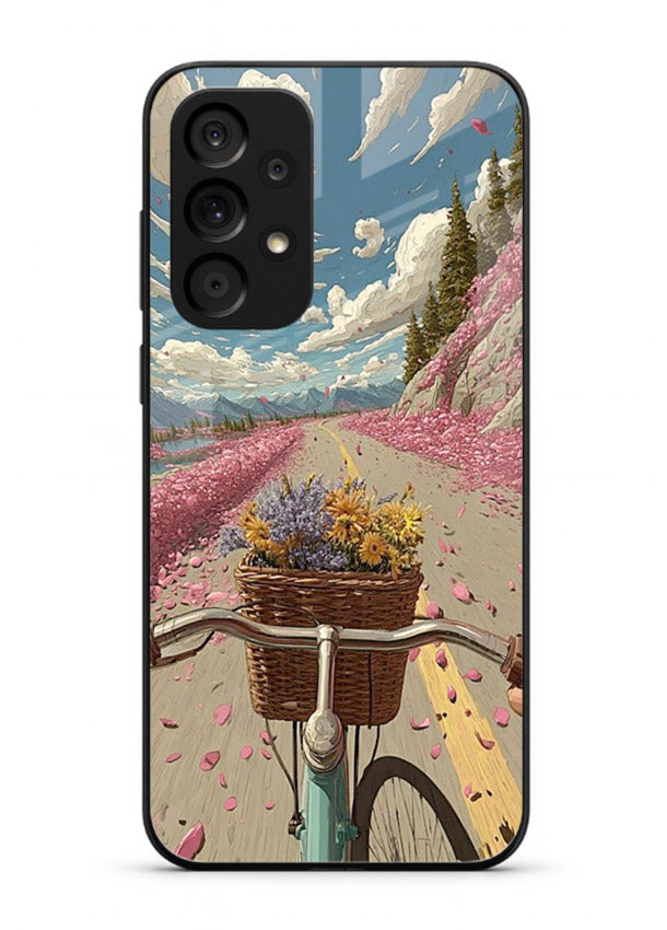 Bicycle with blossom-filled basket artwork on Samsung A33 5G glass back cover with soft scenic floral detailing.