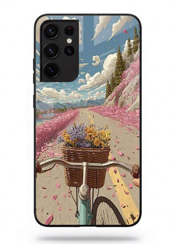 Bicycle with blossom-filled basket artwork on Samsung S21 Ultra glass back cover with soft scenic floral detailing.