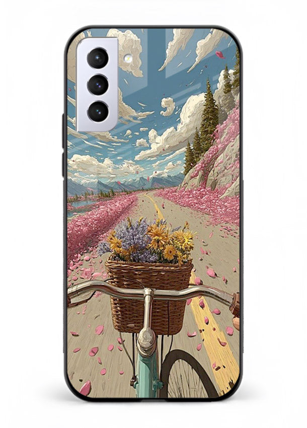 Bicycle with blossom-filled basket artwork on Samsung S21 FE glass back cover with soft scenic floral detailing.