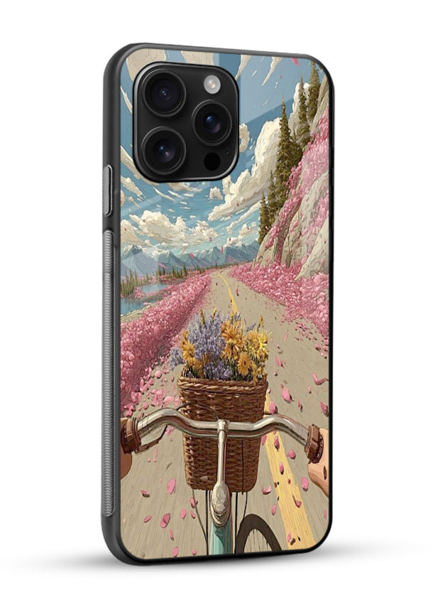 Bicycle with blossom-filled basket artwork on glossy vibrant premium glass back cover with soft scenic floral detailing. - Angle Side
