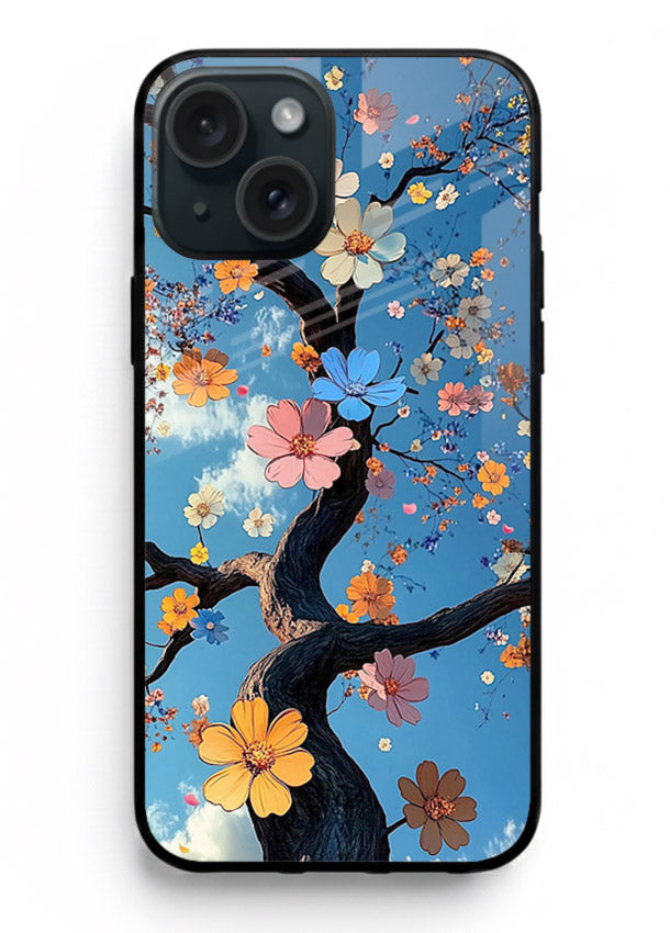 Blue blossom branch artwork on iphone 15 plus glass back cover with cool botanical tones.