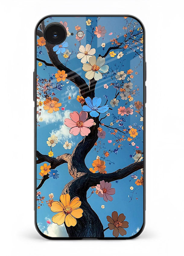 Blue blossom branch artwork on iphone 16e glass back cover with cool botanical tones.