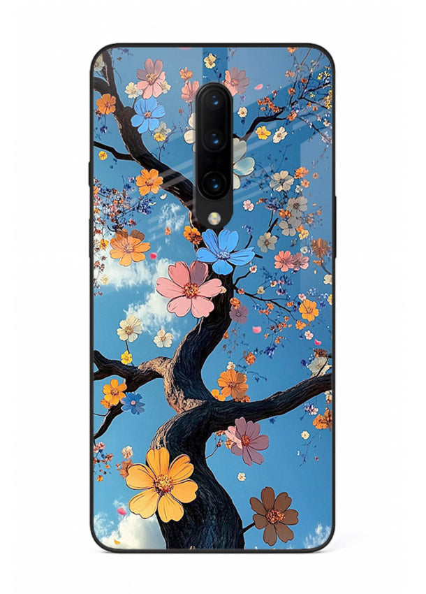 Blue blossom branch artwork on OnePlus 7T Pro glass back cover with cool botanical tones.