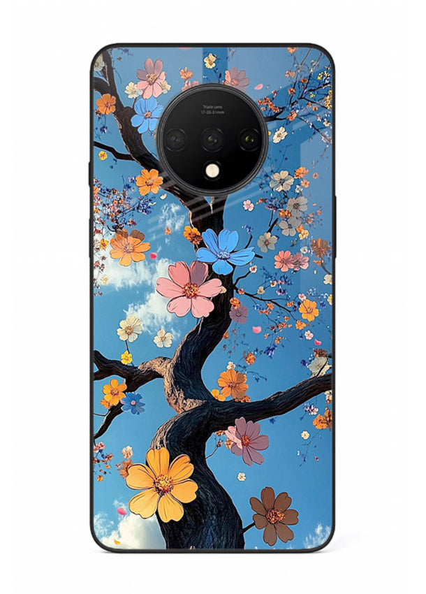 Blue blossom branch artwork on OnePlus 7T glass back cover with cool botanical tones.