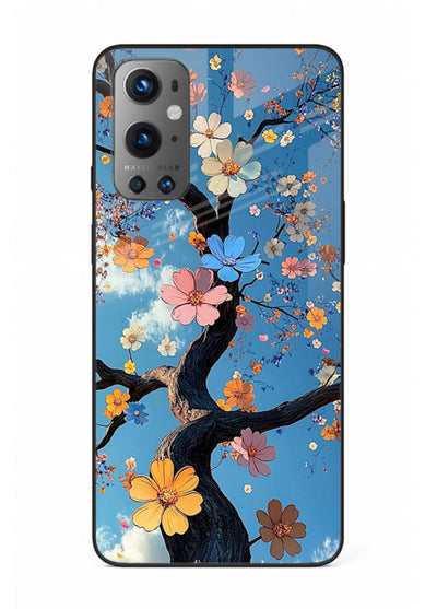 Blue blossom branch artwork on OnePlus 9 glass back cover with cool botanical tones.