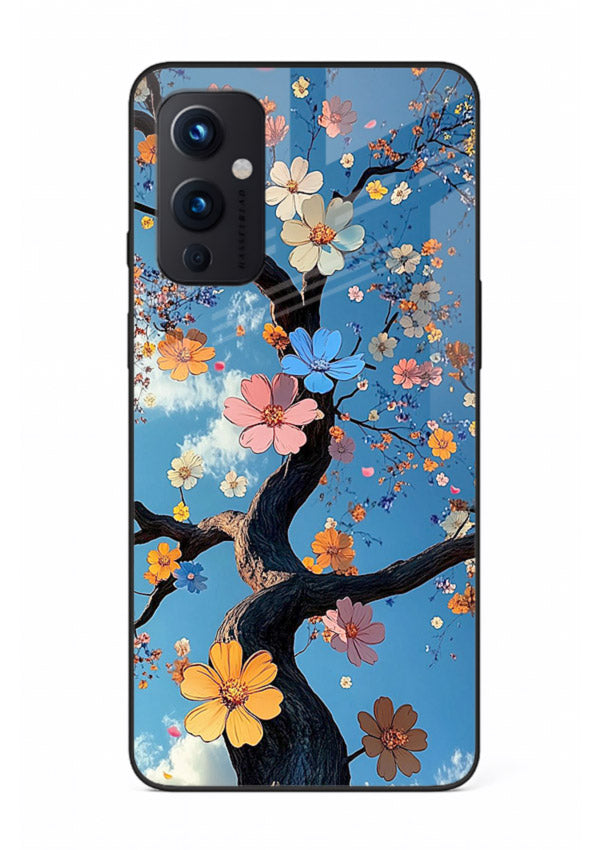 Blue blossom branch artwork on OnePlus 9 Pro glass back cover with cool botanical tones.