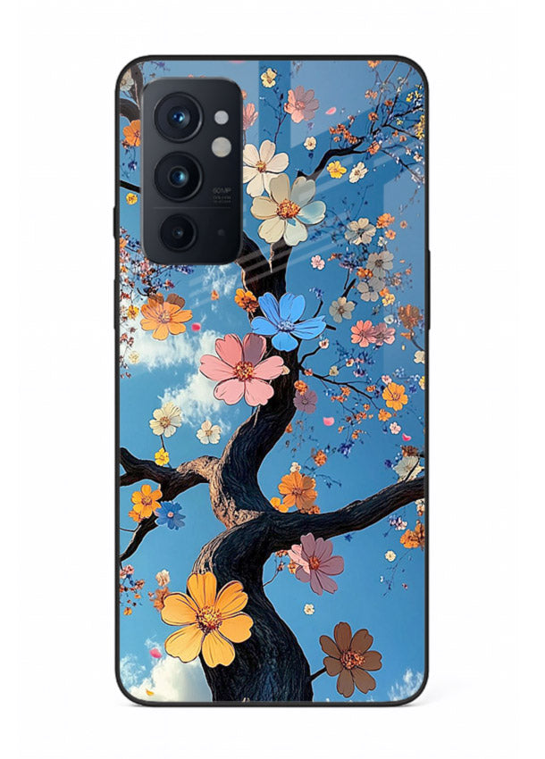 Blue blossom branch artwork on OnePlus 9RT glass back cover with cool botanical tones.