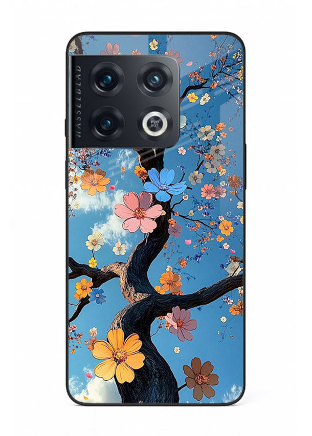 Blue blossom branch artwork on OnePlus 10 Pro glass back cover with cool botanical tones.