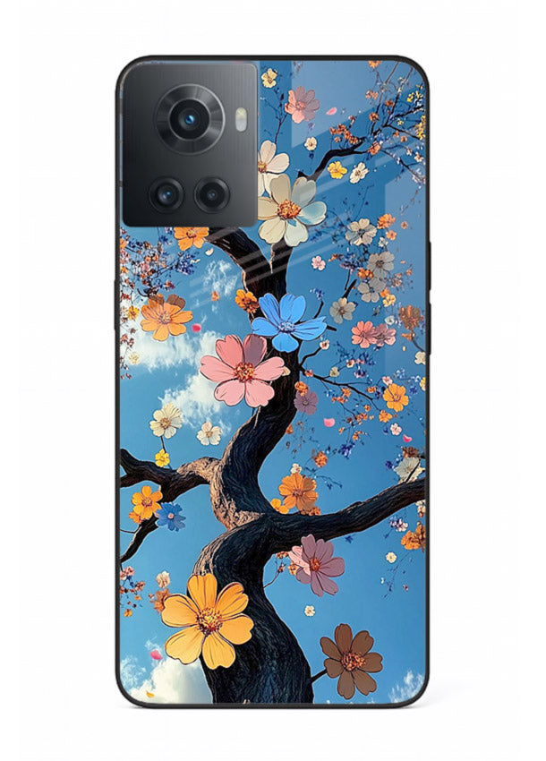 Blue blossom branch artwork on OnePlus 10R glass back cover with cool botanical tones.