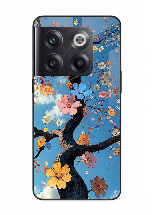 Blue blossom branch artwork on OnePlus 10T glass back cover with cool botanical tones.