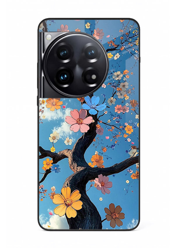 Blue blossom branch artwork on OnePlus 12 glass back cover with cool botanical tones.