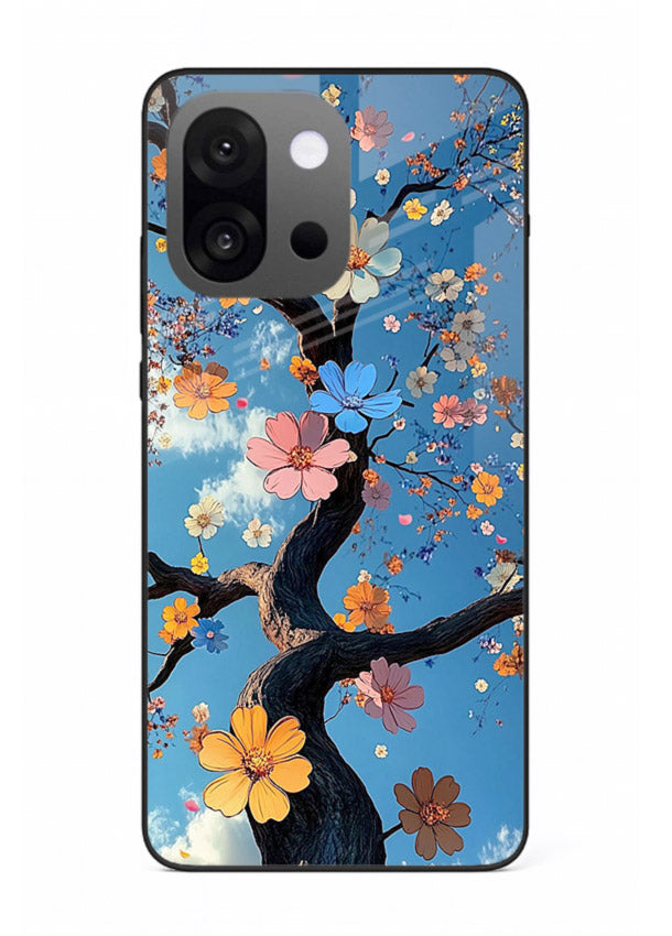 Blue blossom branch artwork on OnePlus 13s glass back cover with cool botanical tones.