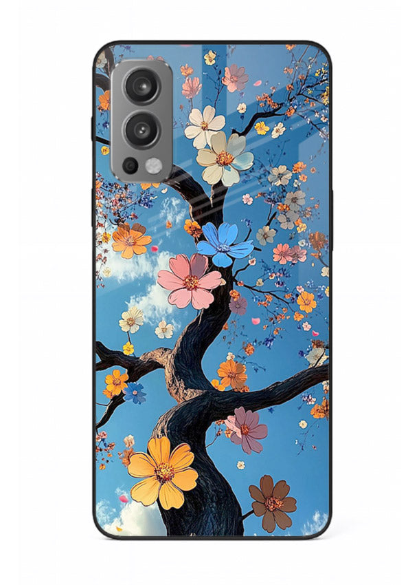Blue blossom branch artwork on OnePlus Nord 2 glass back cover with cool botanical tones.