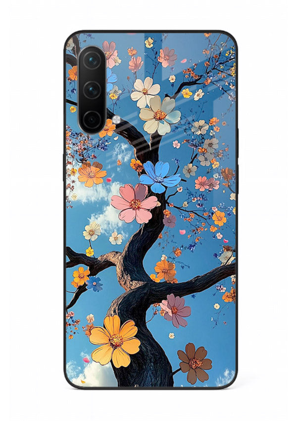 Blue blossom branch artwork on OnePlus Nord CE 5G glass back cover with cool botanical tones.