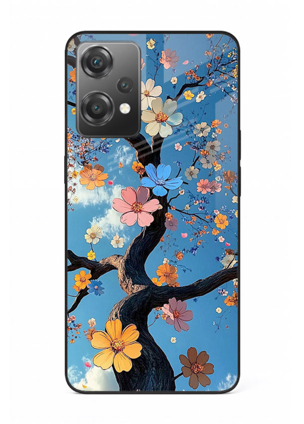 Blue blossom branch artwork on OnePlus Nord CE2 Lite 5G glass back cover with cool botanical tones.