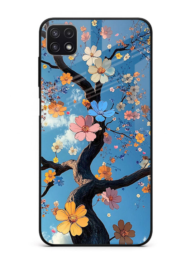 Blue blossom branch artwork on Samsung F42 5G glass back cover with cool botanical tones.