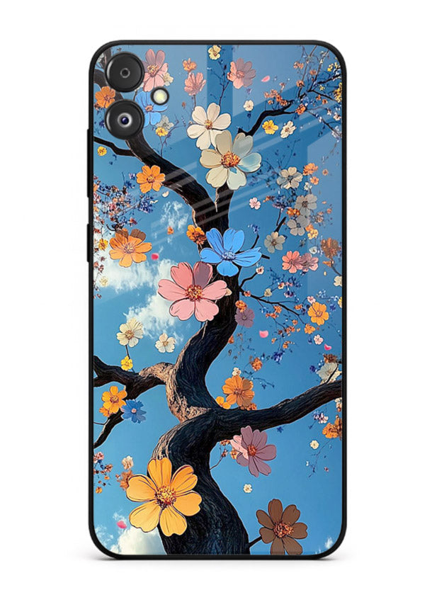 Blue blossom branch artwork on Samsung F04 5G glass back cover with cool botanical tones.
