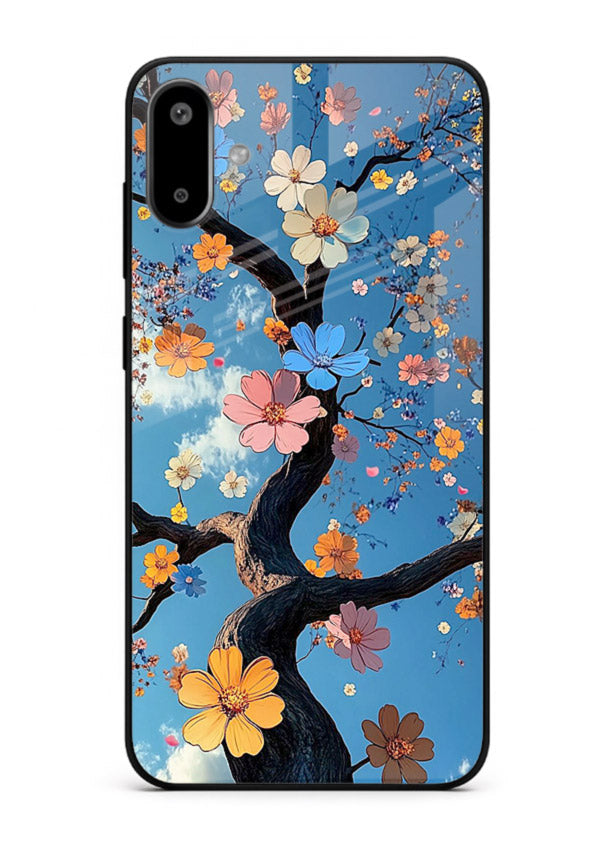 Blue blossom branch artwork on Samsung F06 5G glass back cover with cool botanical tones.