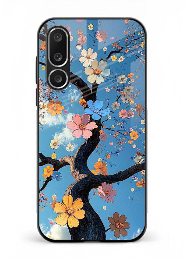 Blue blossom branch artwork on Samsung M36 5G glass back cover with cool botanical tones.