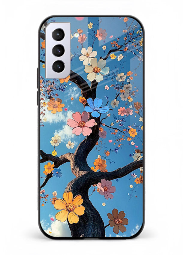 Blue blossom branch artwork on Samsung S21 FE glass back cover with cool botanical tones.