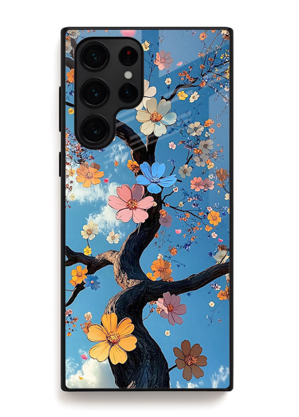 Blue blossom branch artwork on Samsung S25 Ultra glass back cover with cool botanical tones.