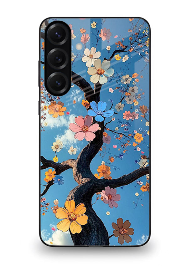 Blue blossom branch artwork on Samsung S24 FE glass back cover with cool botanical tones.