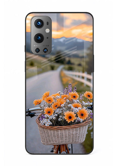 Country floral basket artwork on OnePlus 9 glass back cover with rustic botanical tones.