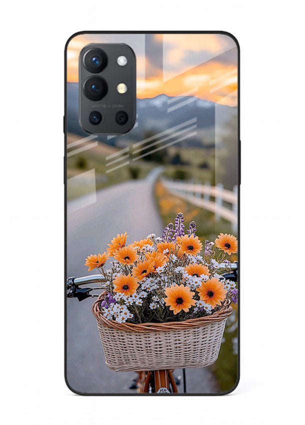 Country floral basket artwork on OnePlus 9R glass back cover with rustic botanical tones.