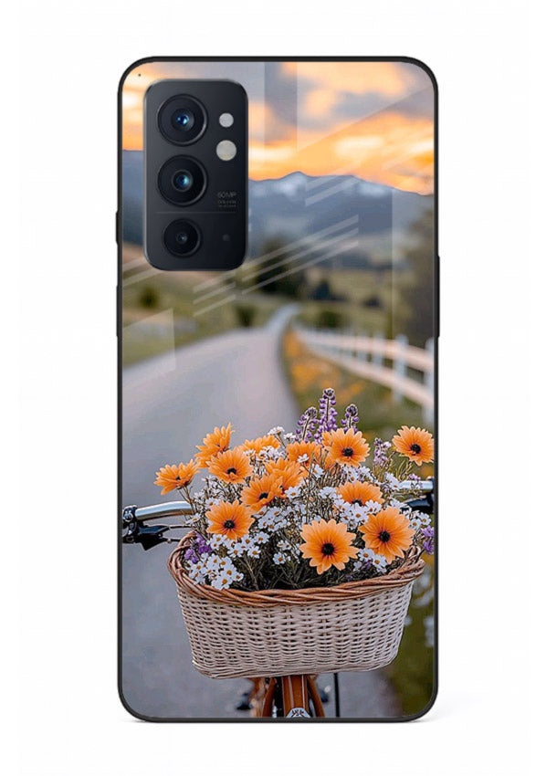 Country floral basket artwork on OnePlus 9RT glass back cover with rustic botanical tones.