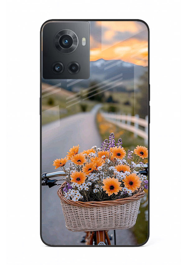 Country floral basket artwork on OnePlus 10R glass back cover with rustic botanical tones.