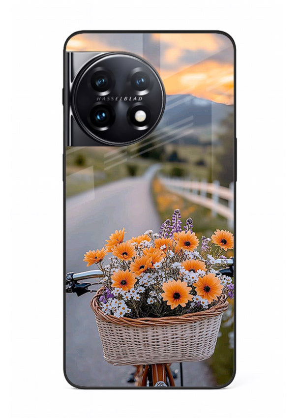 Country floral basket artwork on OnePlus 11 glass back cover with rustic botanical tones.