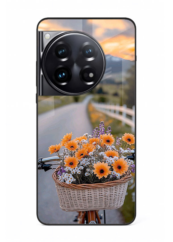 Country floral basket artwork on OnePlus 12 glass back cover with rustic botanical tones.
