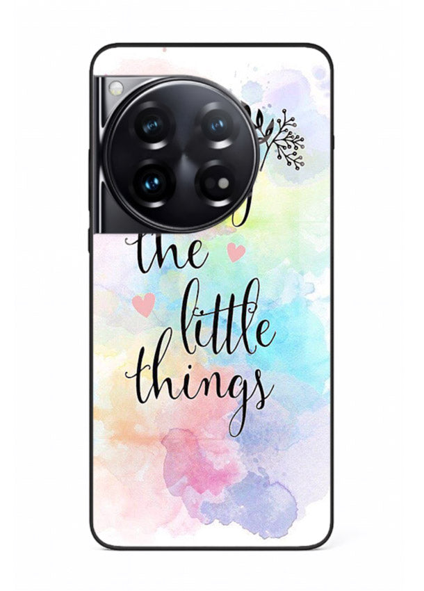 Watercolor splash quote printed on OnePlus 12 glass back cover with colorful soft tones.